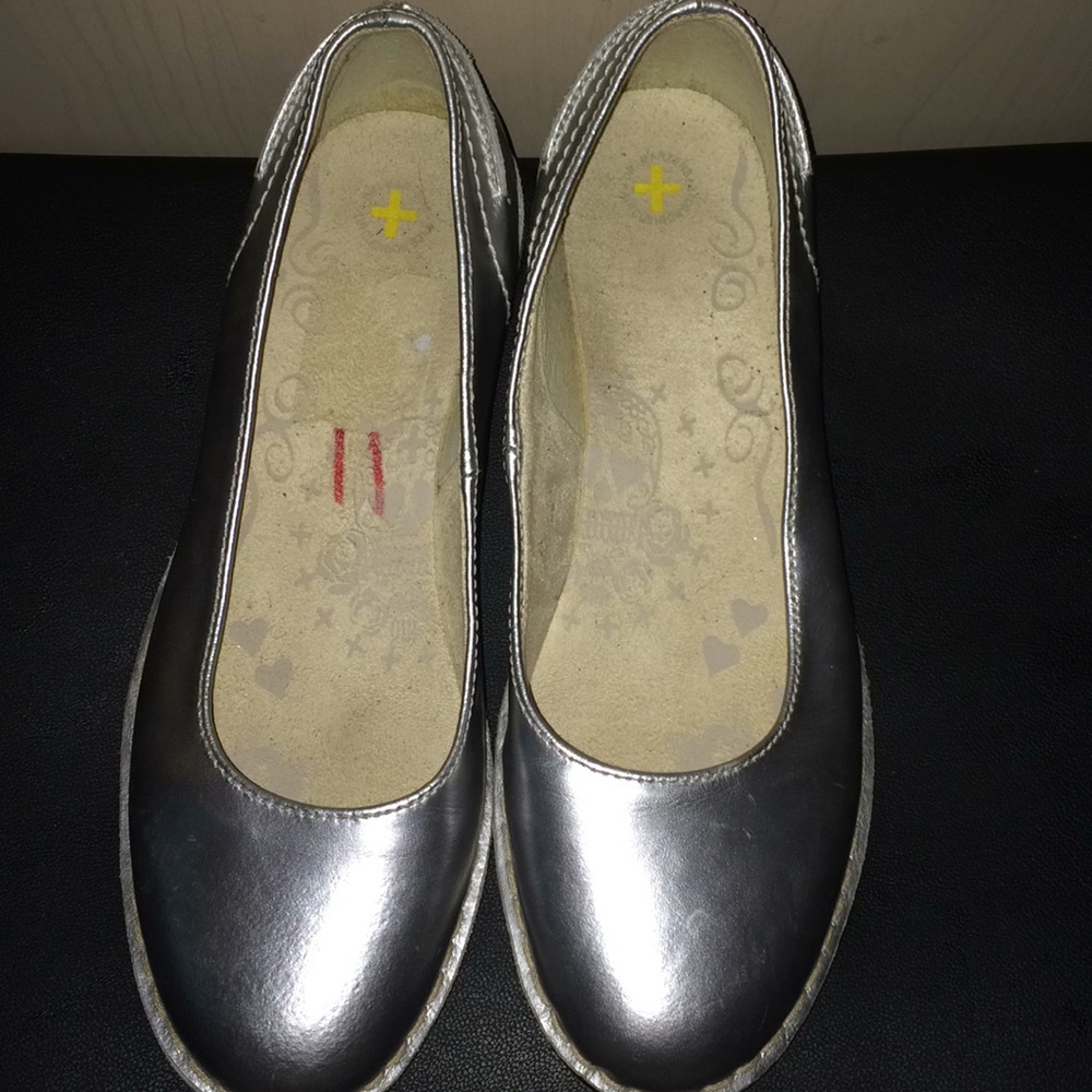 Gently used metallic silver flats by Dr. Martens